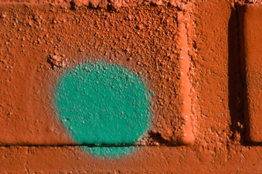 Photo 27483: Brick wall with grafitti: Green dots on orange background