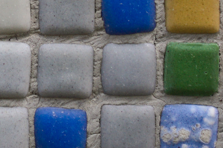 Photo 27503: Mosaic wall of small, grey, green, blue and yellow tiles